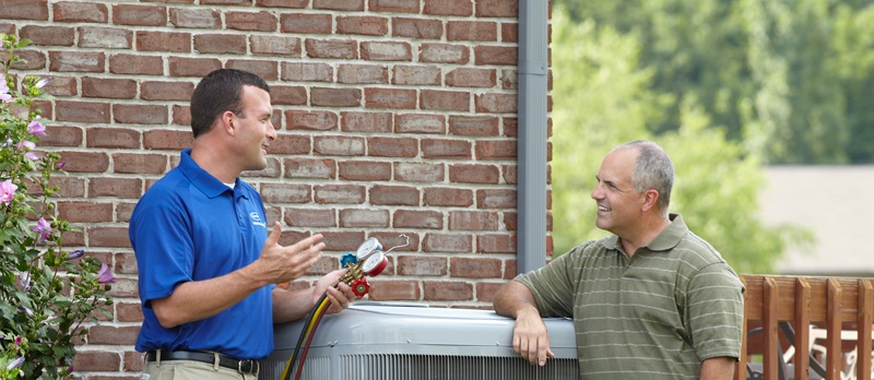 Homeowner Talking To Technician